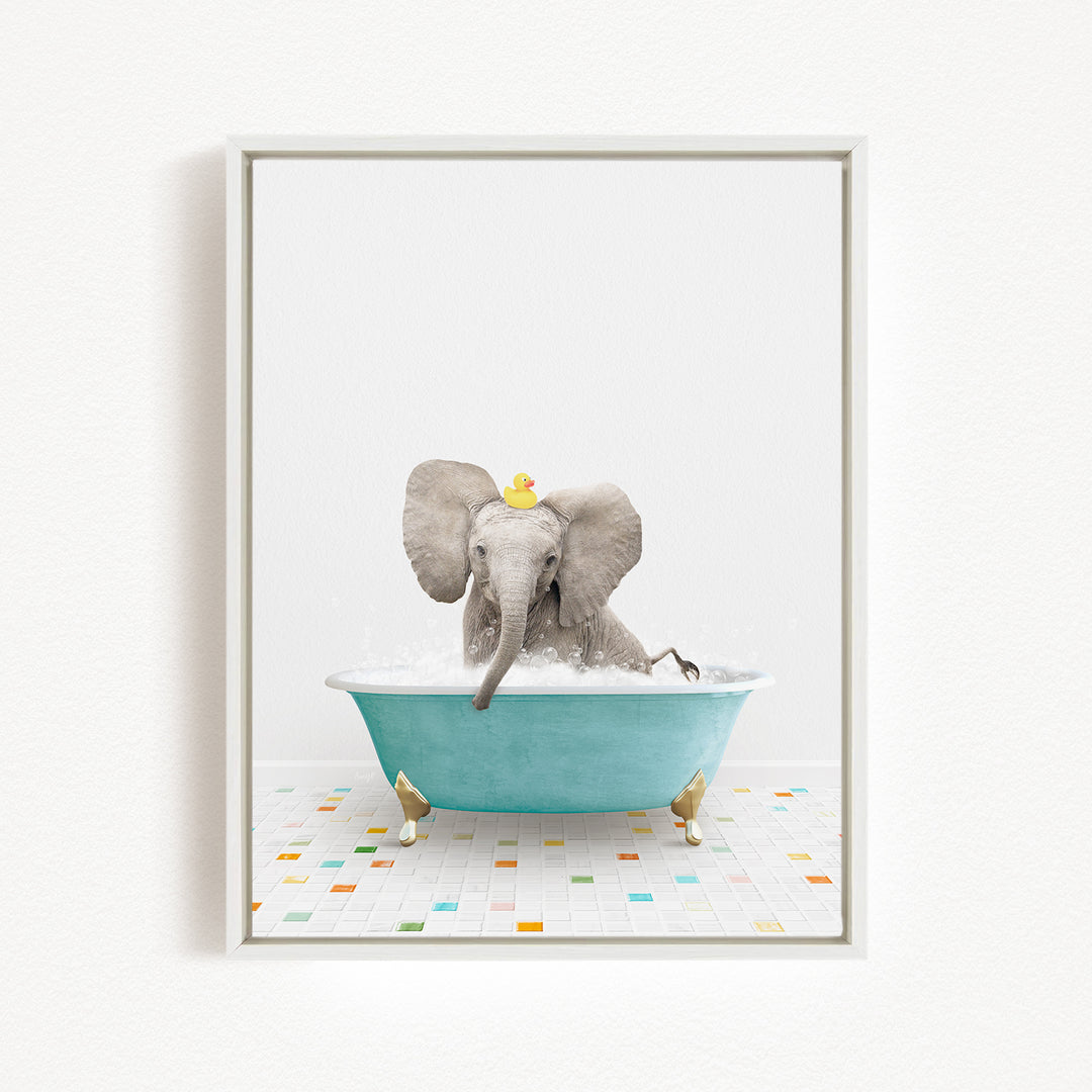 A baby elephant sitting in a blue bathtub, with a yellow rubber duck on its head, against a white background.
