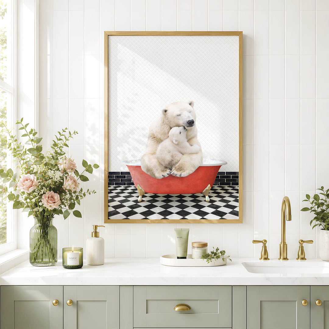 A framed image of a polar bear sitting in a red bathtub, surrounded by a black and white checkered floor and a vase of pink flowers, is displayed on a white wall above a bathroom sink.