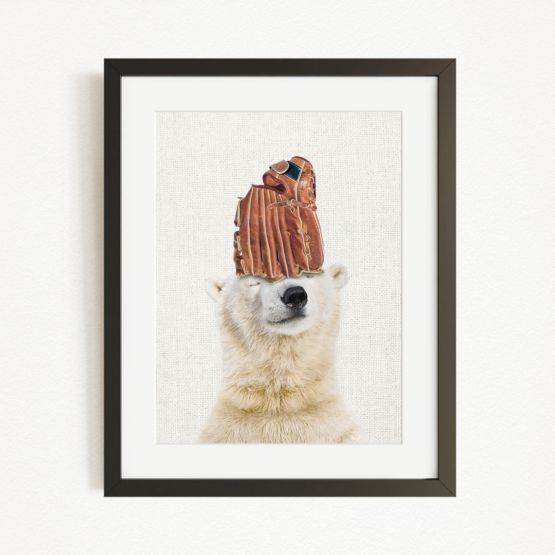 A polar bear wearing a baseball glove on its head, with its eyes closed, in a framed artwork.