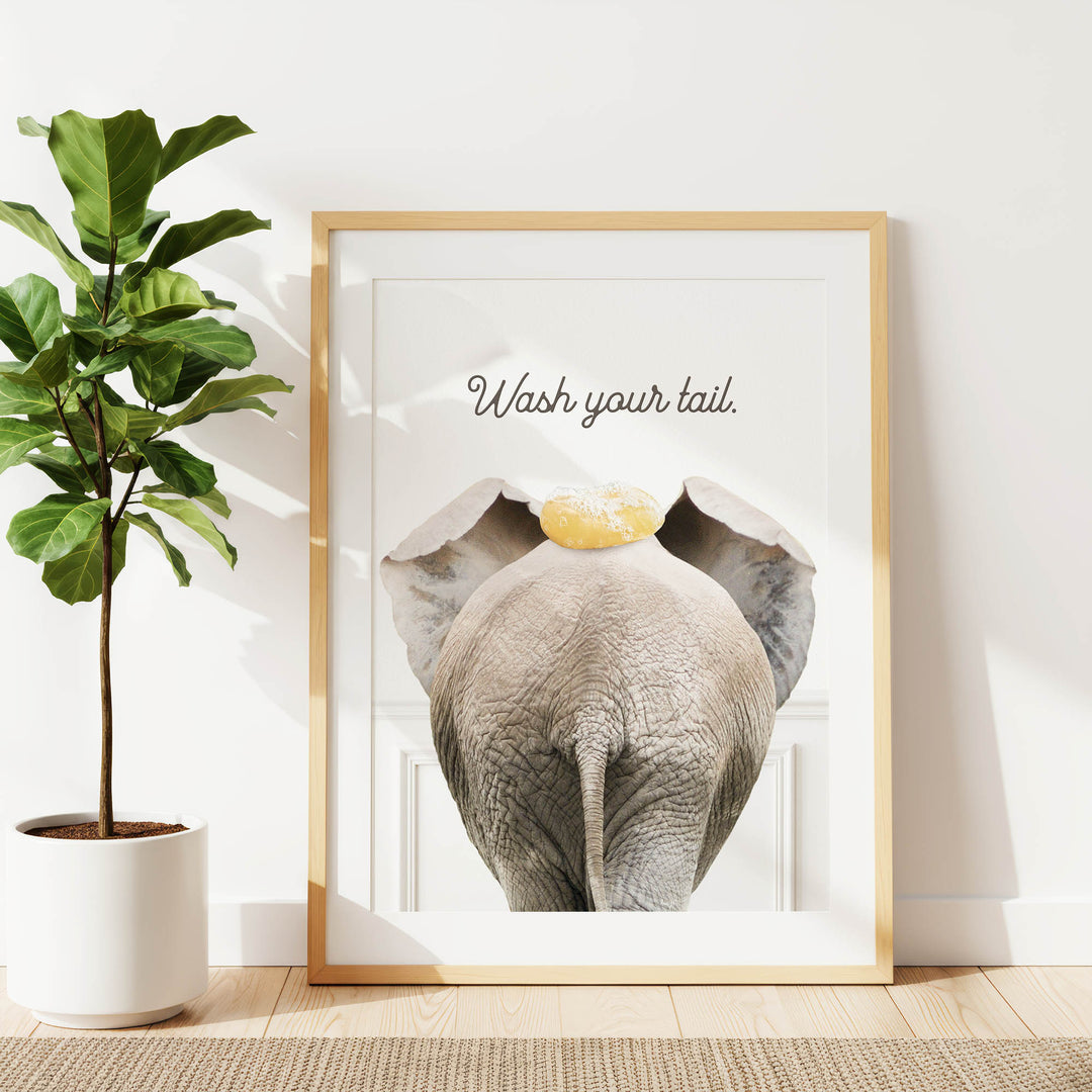 a framed poster of an elephant with the text "Wash your tail."