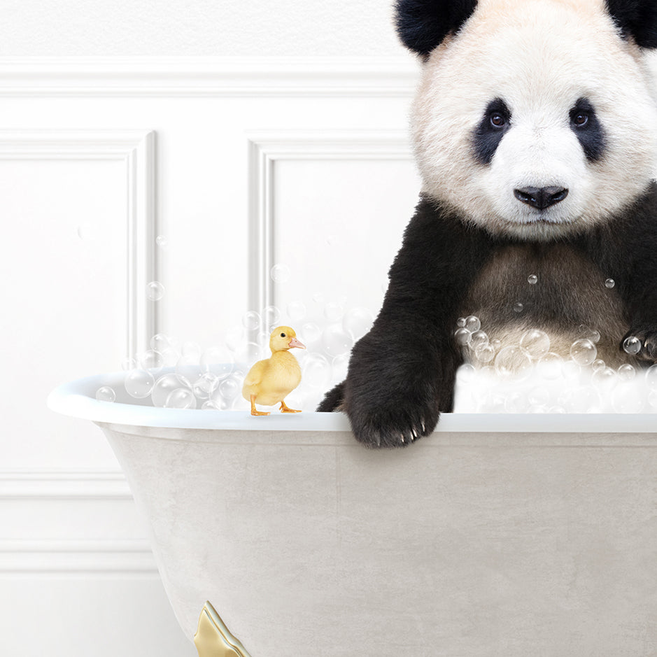 a panda bear sitting in a bathtub with a rubber duck