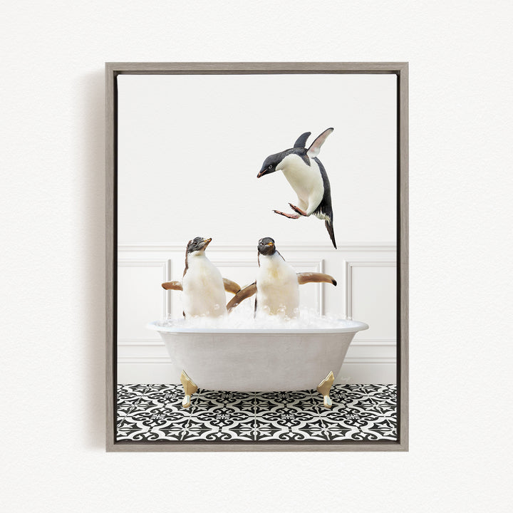 A framed image depicting three penguins in a bathtub, with one penguin flying out of the tub.