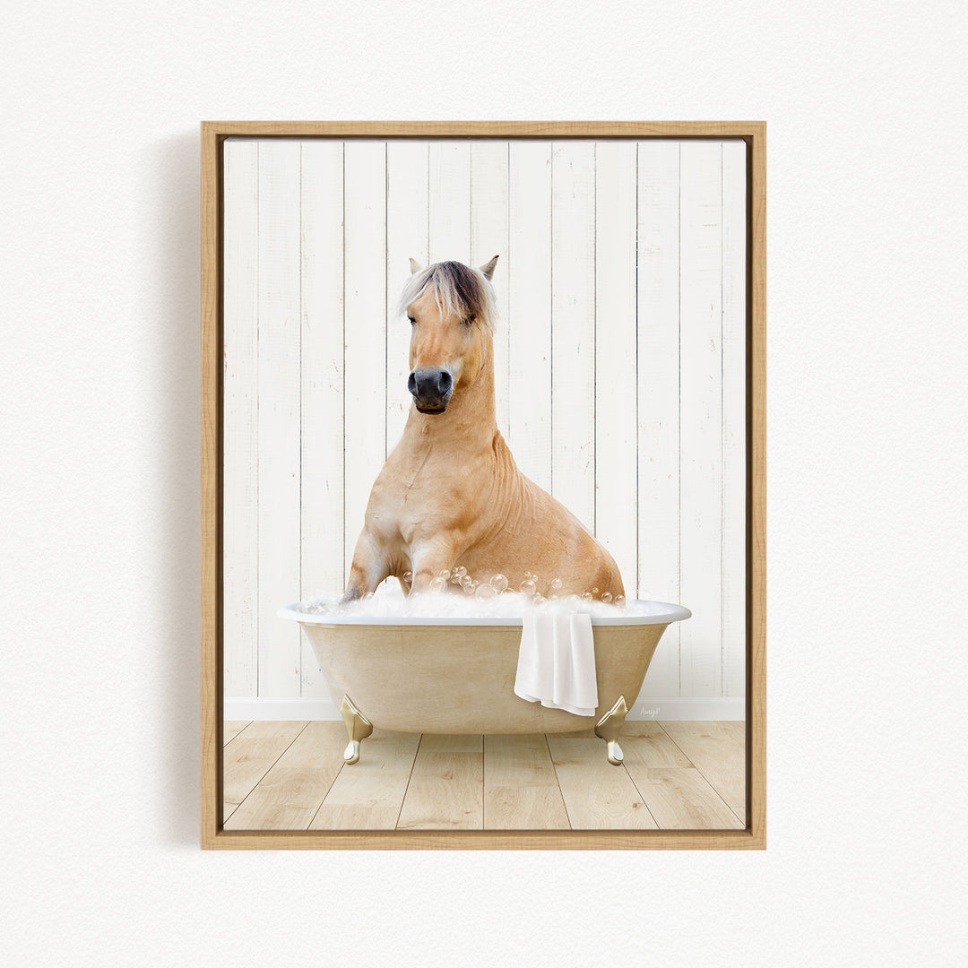 A brown horse sitting in a white bathtub filled with water, with a towel draped over the side of the tub.