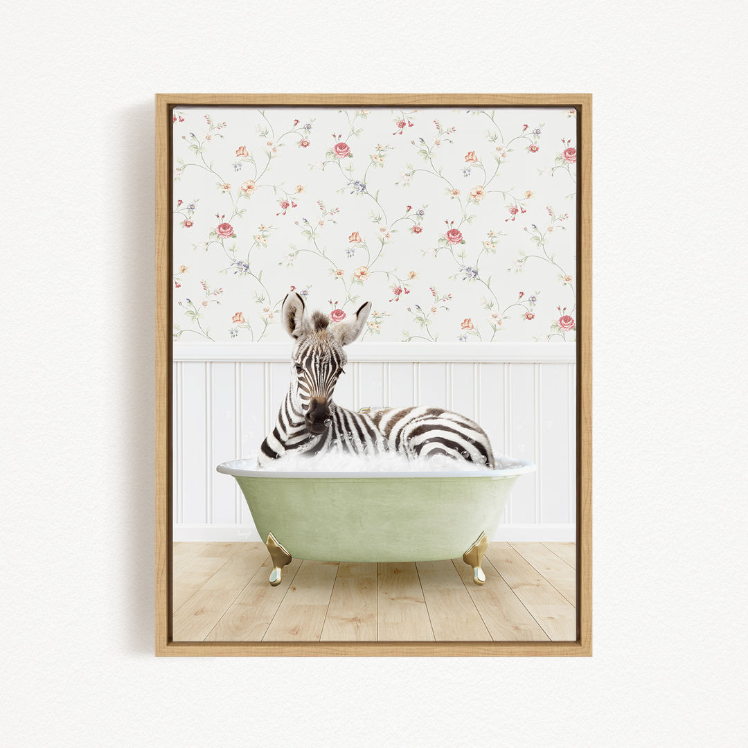 A zebra is sitting in a green bathtub, surrounded by a floral wallpaper.