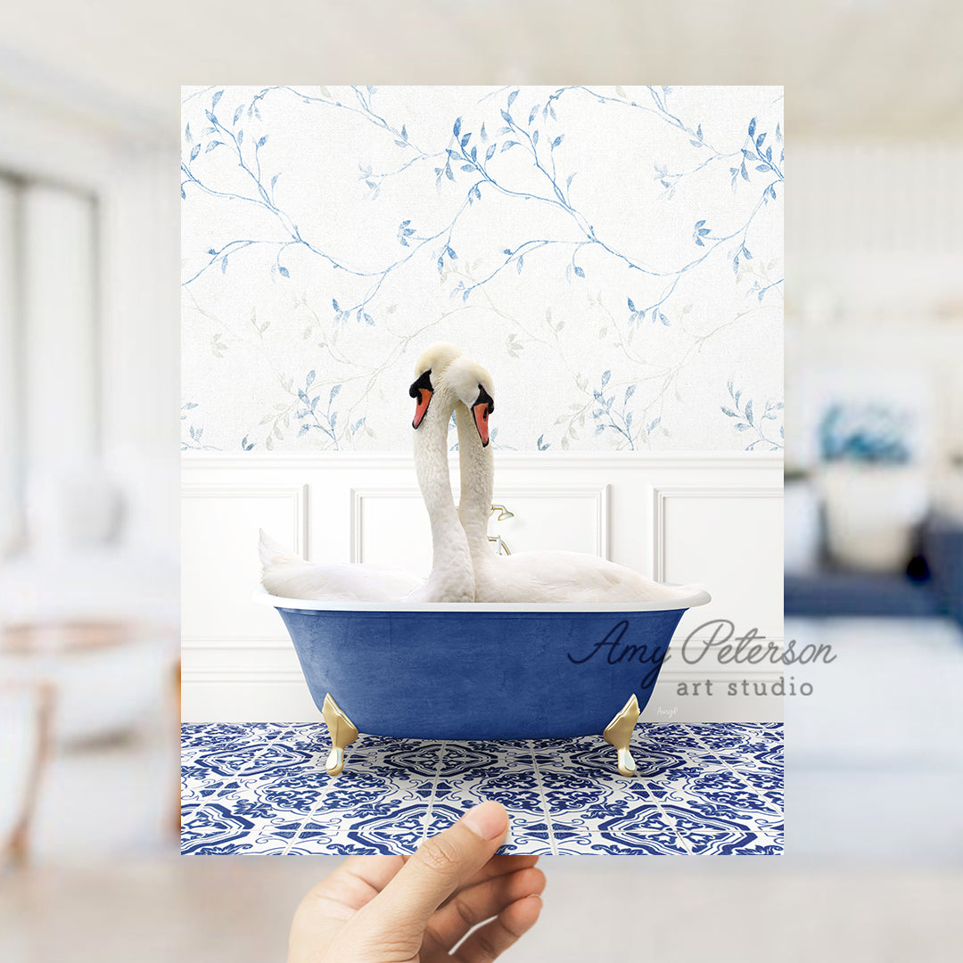 a person holding a card with a picture of a swan in a bathtub