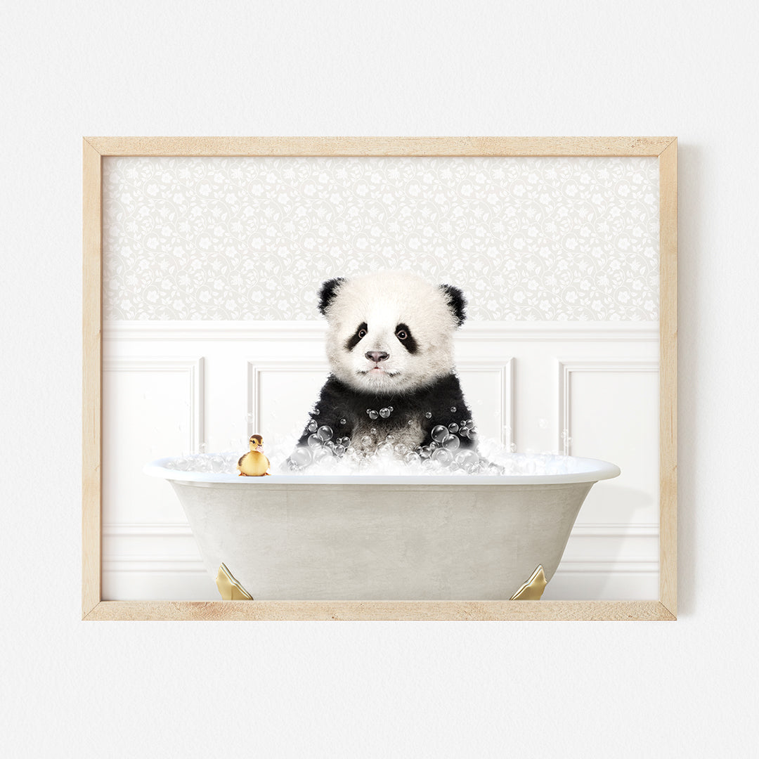 a panda bear sitting in a bathtub with a bottle