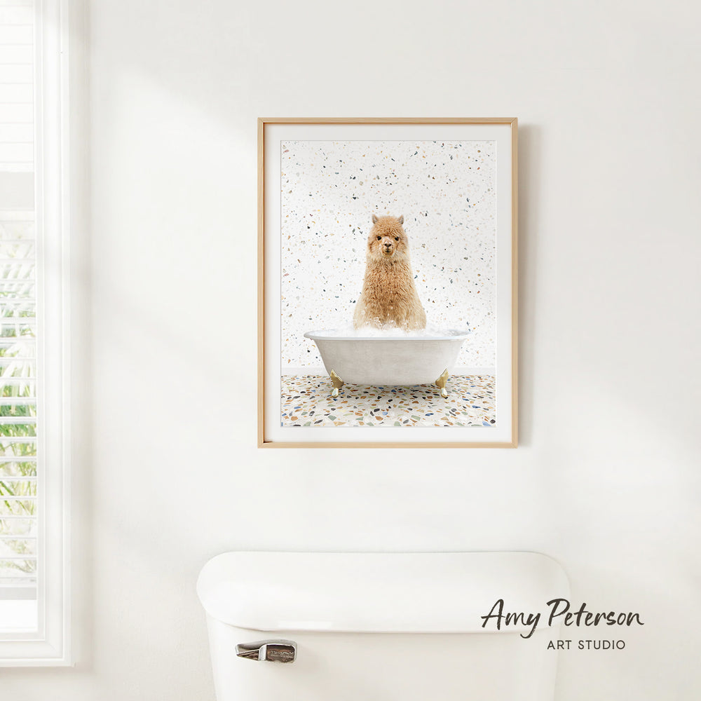 A framed print of a dog sitting in a bathtub is hanging on a white wall above a white toilet.