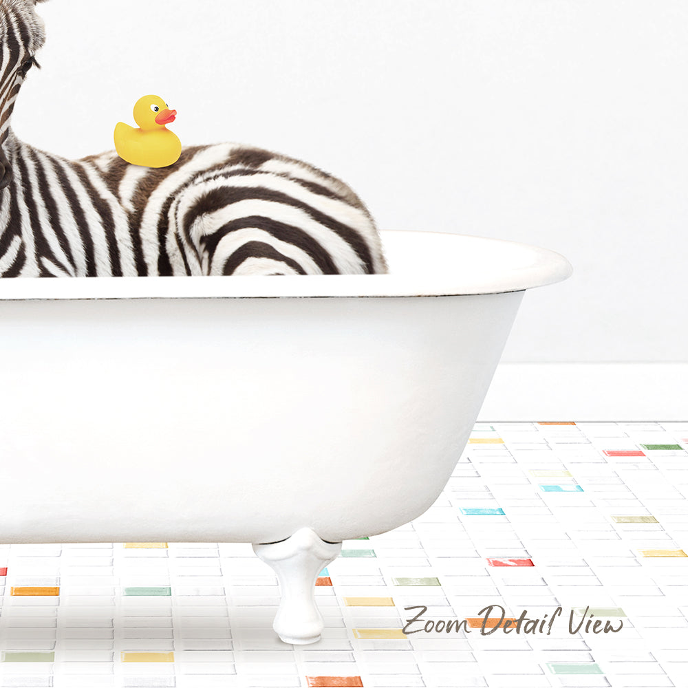 A zebra is sitting in a white bathtub, with a rubber duck perched on its back.