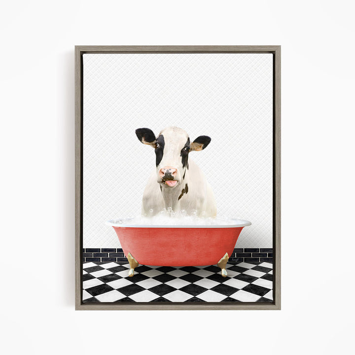A black and white cow is sitting in a red bathtub filled with water, creating a whimsical and humorous scene.
