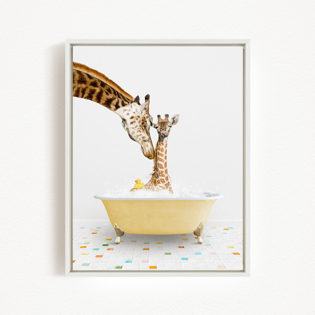 A giraffe and a baby giraffe are sitting in a yellow bathtub filled with bubbles, with a yellow rubber duck floating in the water.