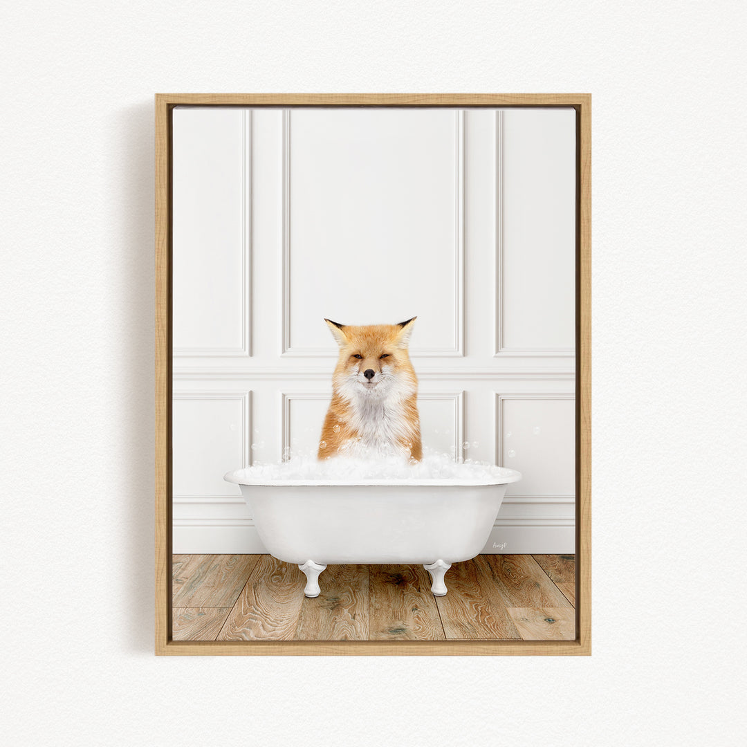 A red fox is sitting in a white bathtub filled with bubbles, looking directly at the camera.