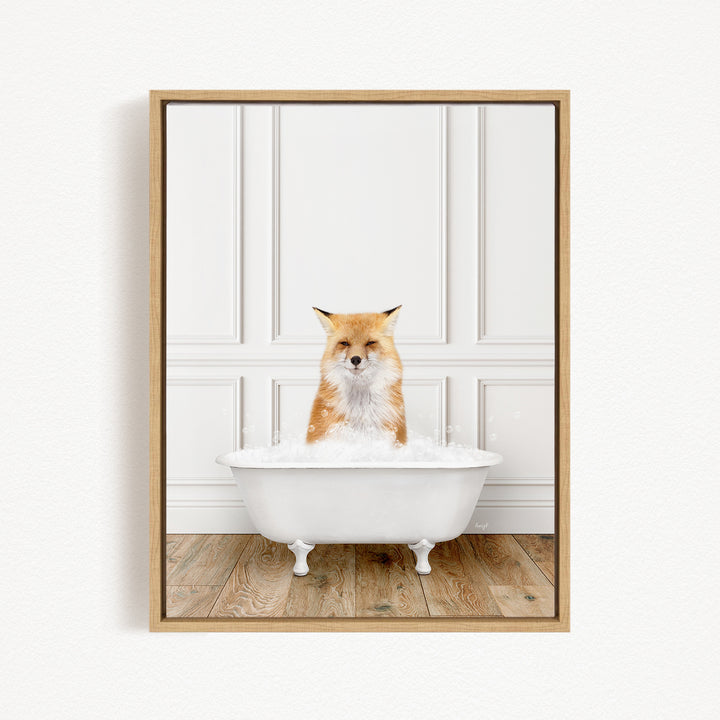 A red fox is sitting in a white bathtub filled with bubbles, looking directly at the camera.
