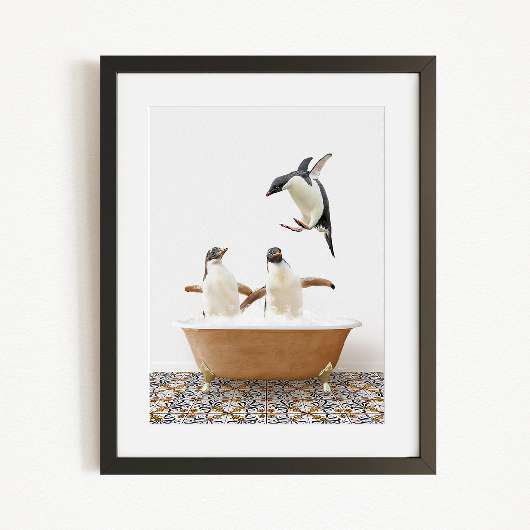 A framed image depicting two penguins sitting in a bathtub, with one penguin flying towards the other.
