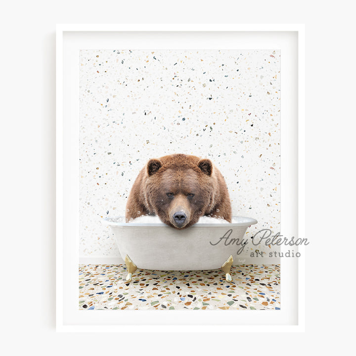 a brown bear sitting in a bath tub