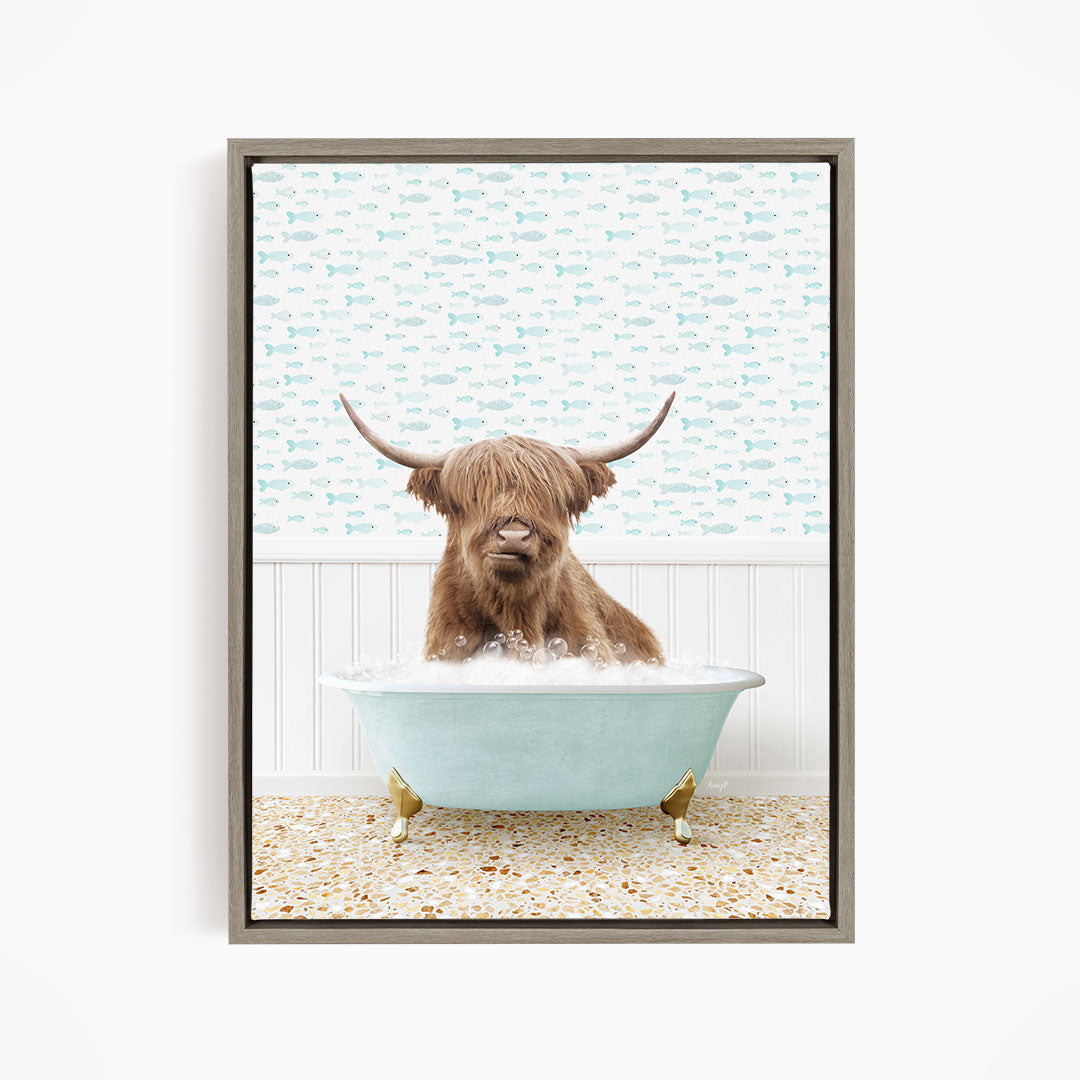 A brown cow with long horns is sitting in a light blue bathtub filled with bubbles, surrounded by a pattern of fish.