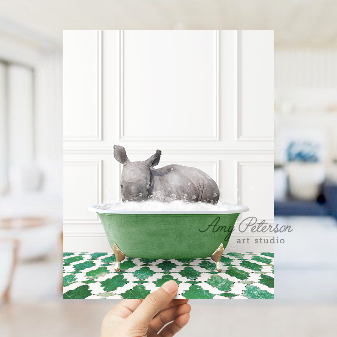 a hand holding a card with a rhino in a bathtub