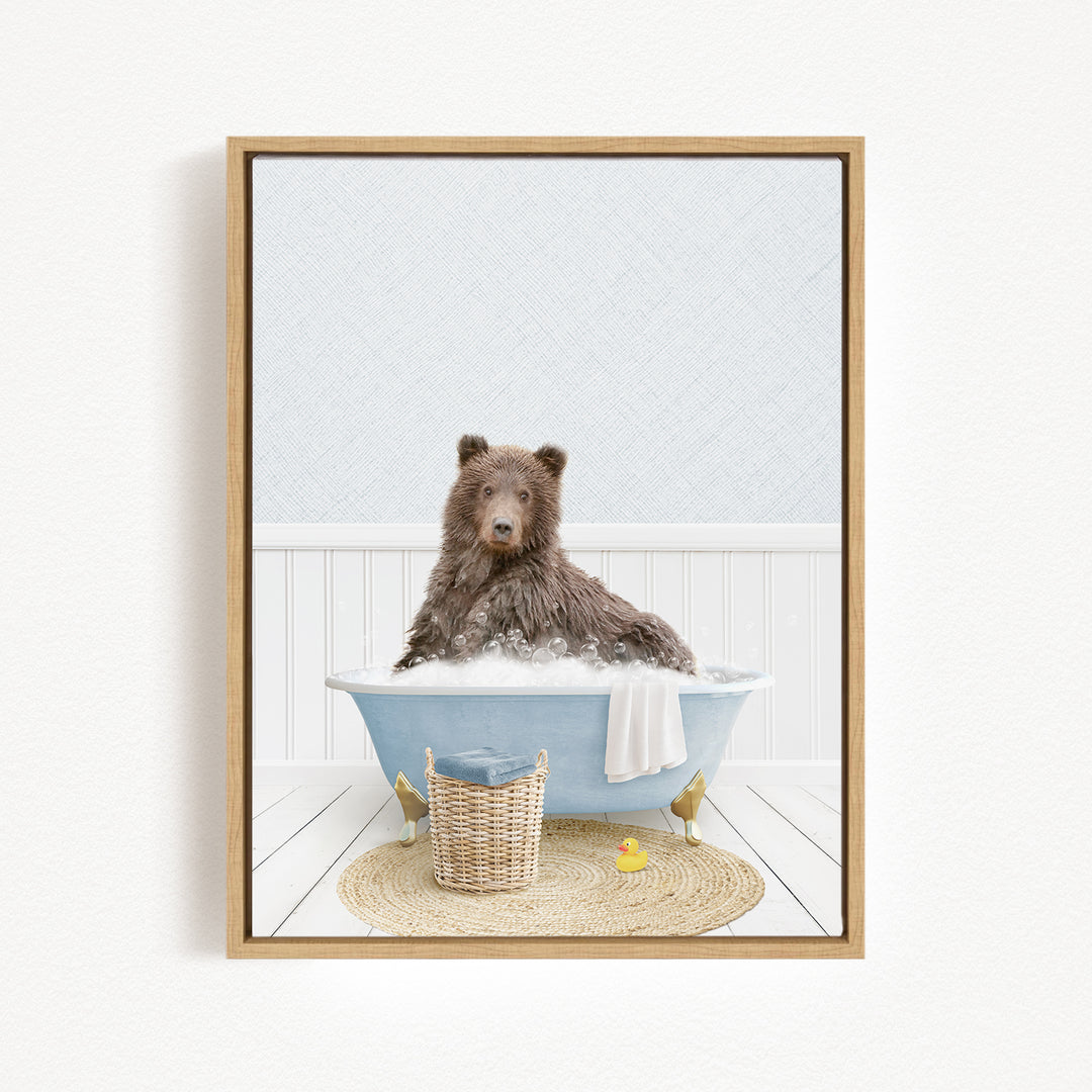 A brown bear sitting in a blue bathtub filled with water, surrounded by a yellow rubber duck and a woven basket.