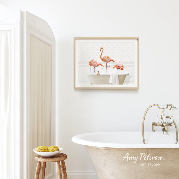 a bathroom with a framed painting of three flamingos in a bathtub, a wooden stool, and a bowl of fruit.