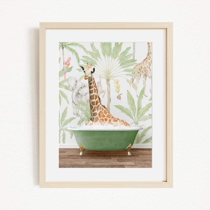 A giraffe is sitting in a green bathtub, surrounded by tropical foliage, in the image.