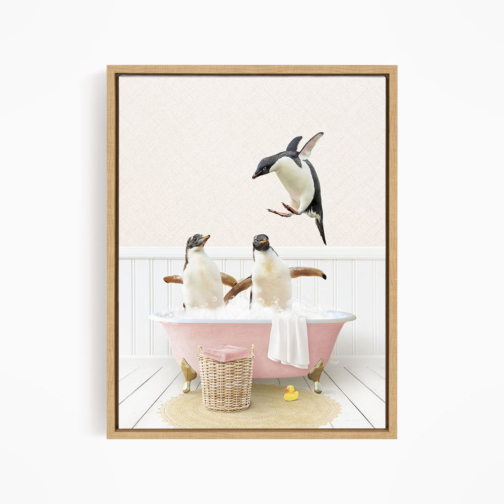 A framed image depicting two penguins sitting in a pink bathtub, with one penguin flying towards the other.