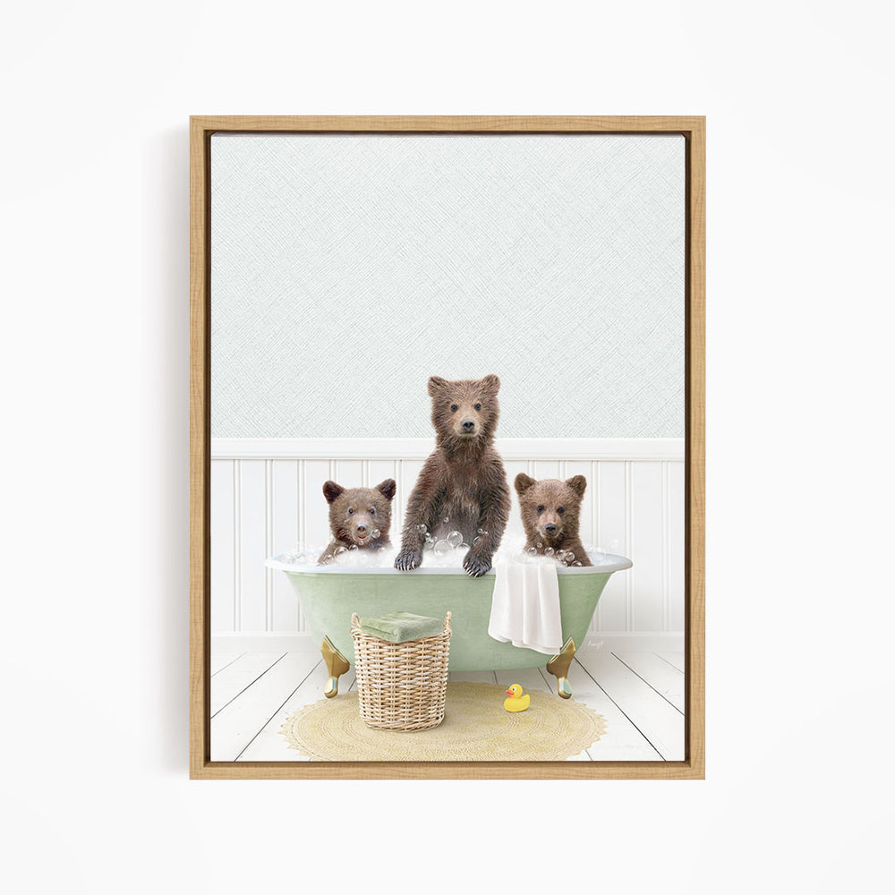 A framed image depicting three bears sitting in a green bathtub, with one bear standing and the other two sitting.