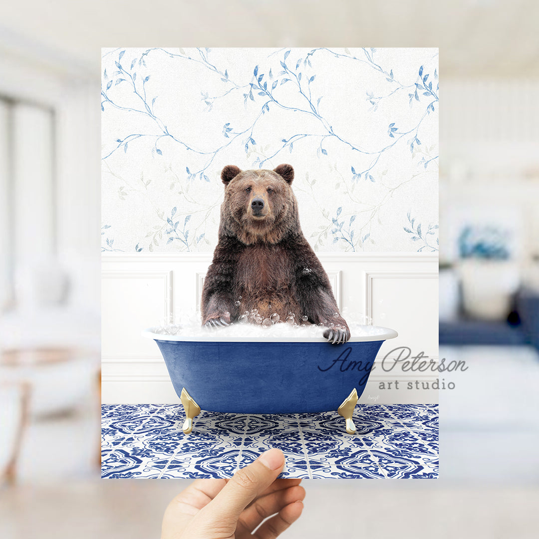 a person holding up a card with a bear in a bathtub