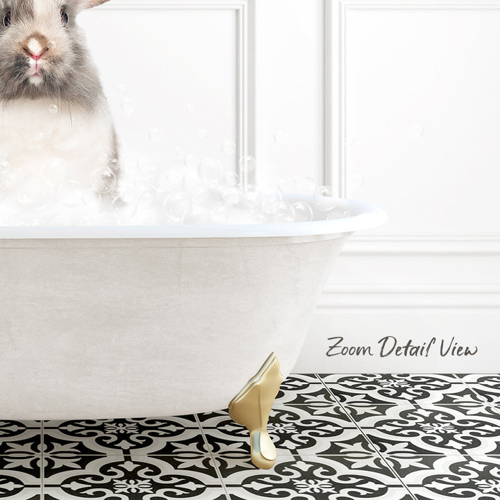 A white bathtub filled with bubbles, with a small rabbit sitting inside and enjoying the bath.