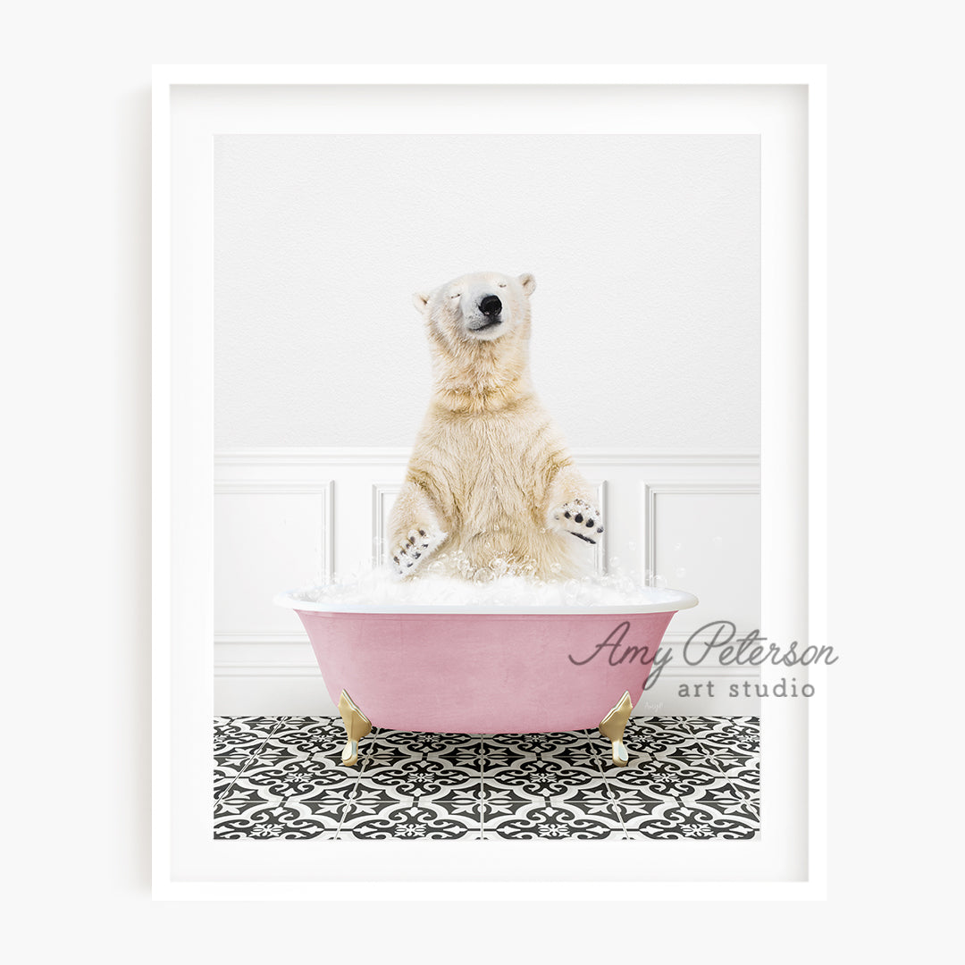 a polar bear sitting in a pink bath tub