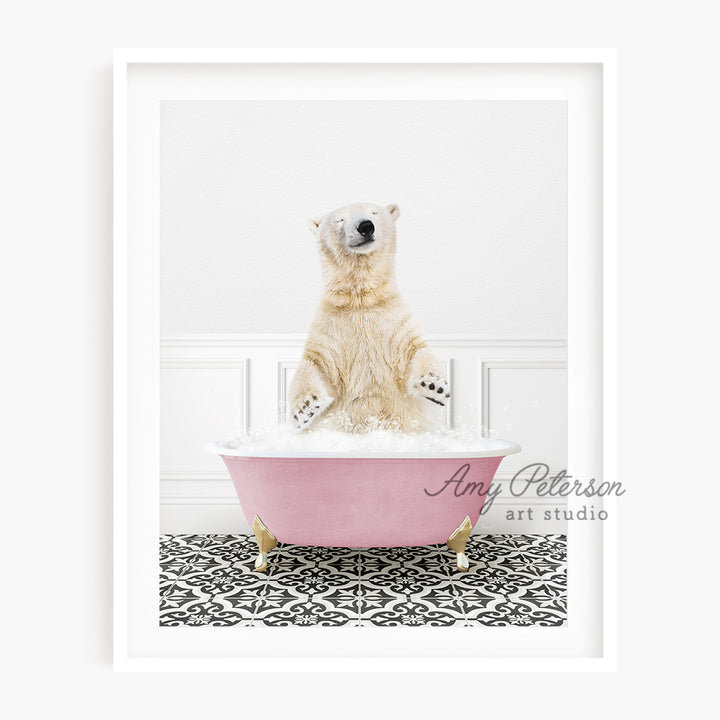 a polar bear sitting in a pink bath tub