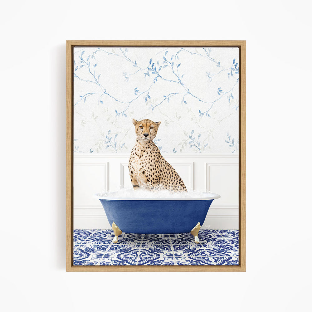 A cheetah sitting in a blue bathtub, with a patterned tile floor and a floral wallpaper in the background.