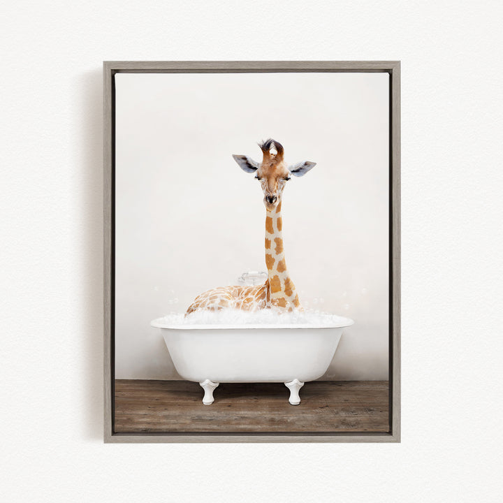 A giraffe is sitting in a white bathtub filled with bubbles, creating a whimsical and playful scene.