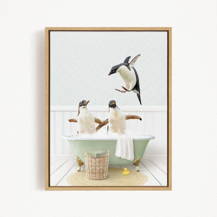 A framed image depicting two penguins sitting in a bathtub, with one penguin flying towards the other penguin.
