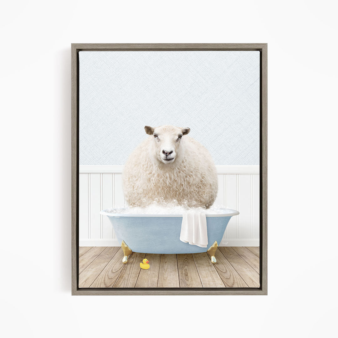 A fluffy white sheep sits in a blue bathtub filled with bubbles, surrounded by yellow rubber duckies.