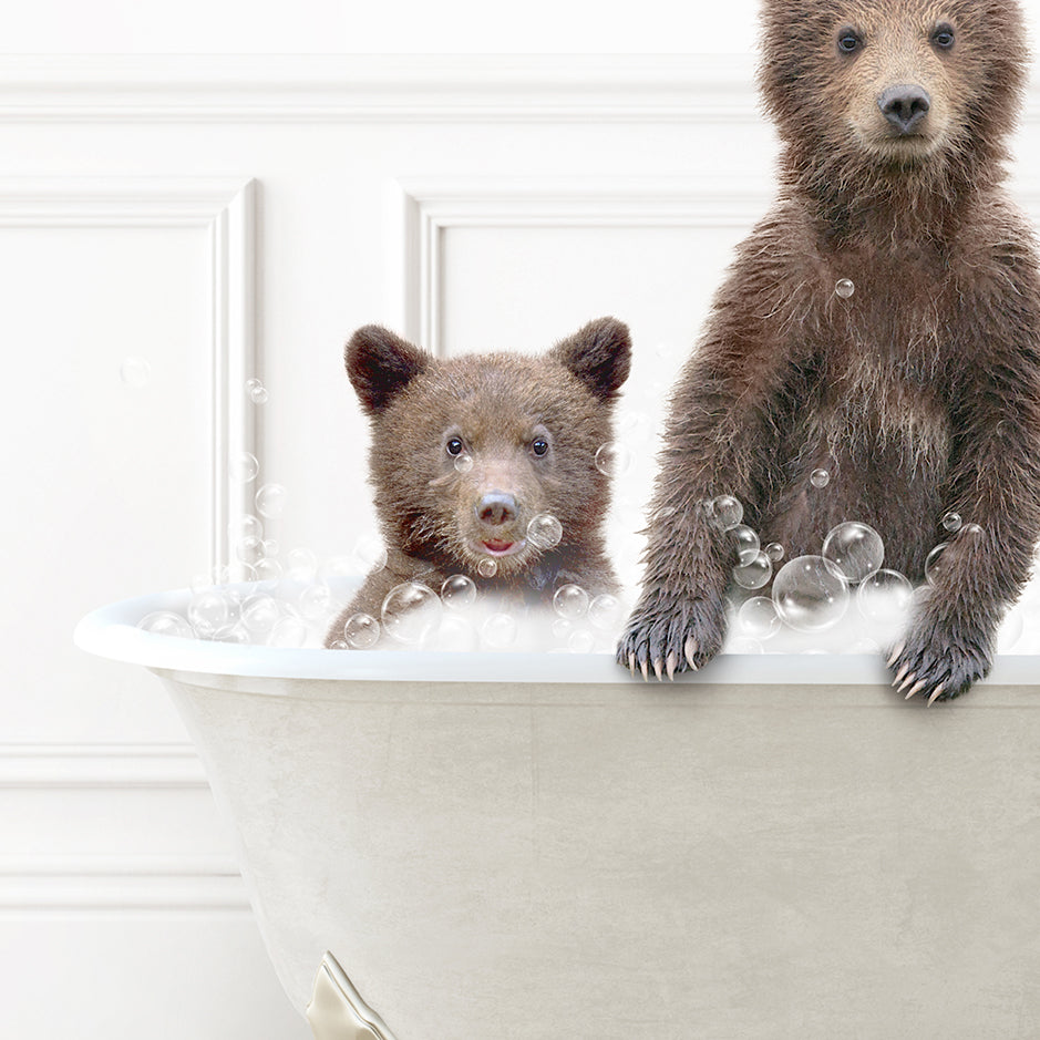 a couple of brown bears sitting inside of a bath tub