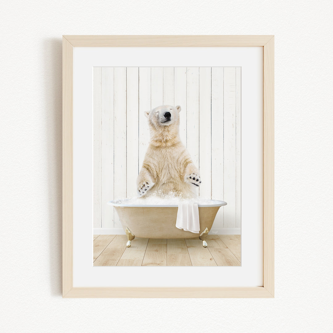 A polar bear sitting in a bathtub filled with water, with its paws raised in the air.