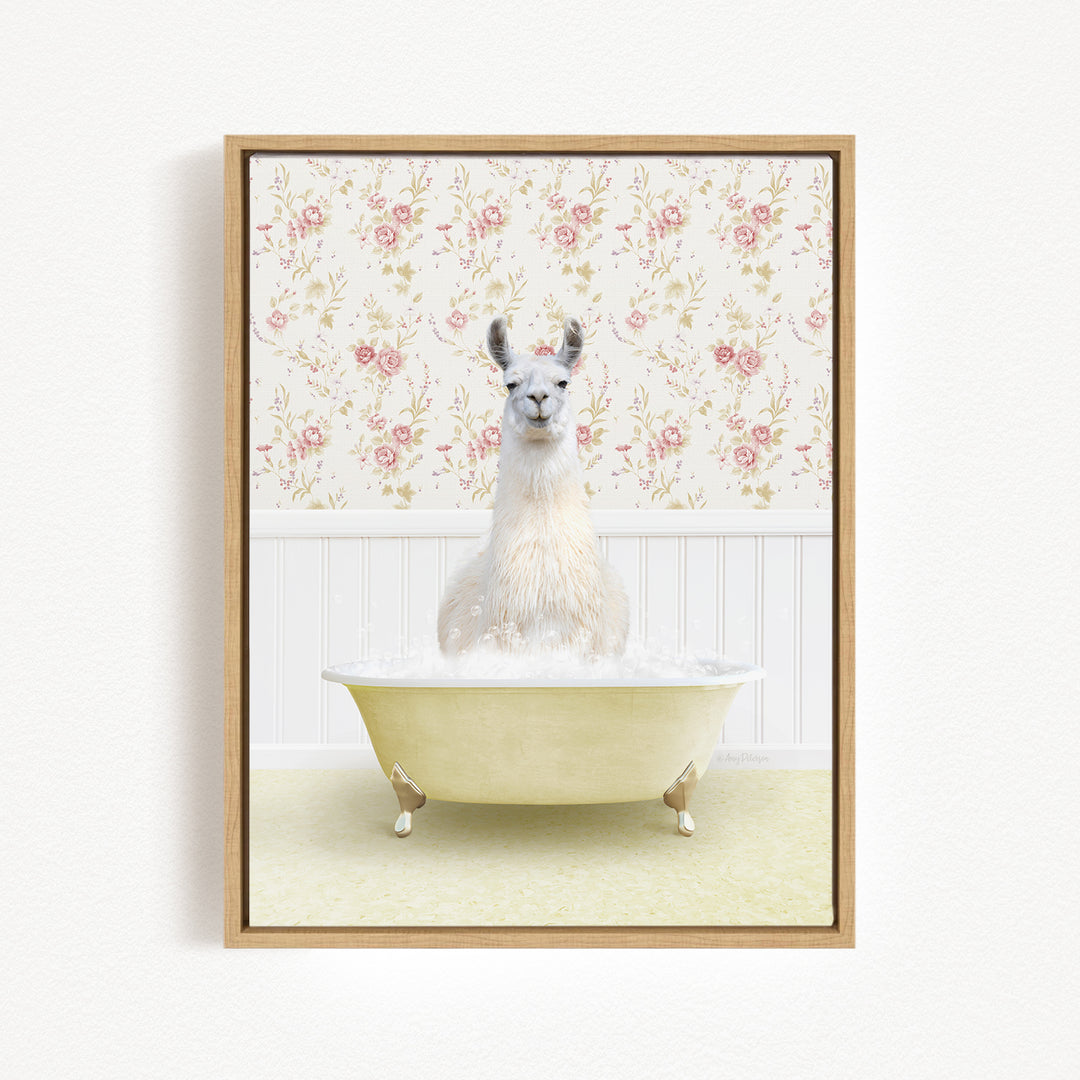 A white llama sitting in a yellow bathtub filled with bubbles, against a floral wallpaper background.
