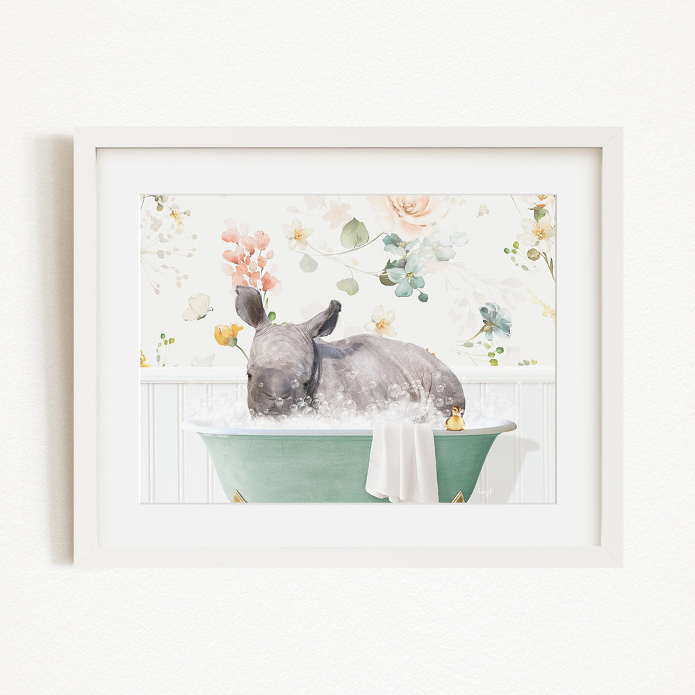 A rhinoceros is sitting in a green bathtub filled with water, surrounded by a floral background.