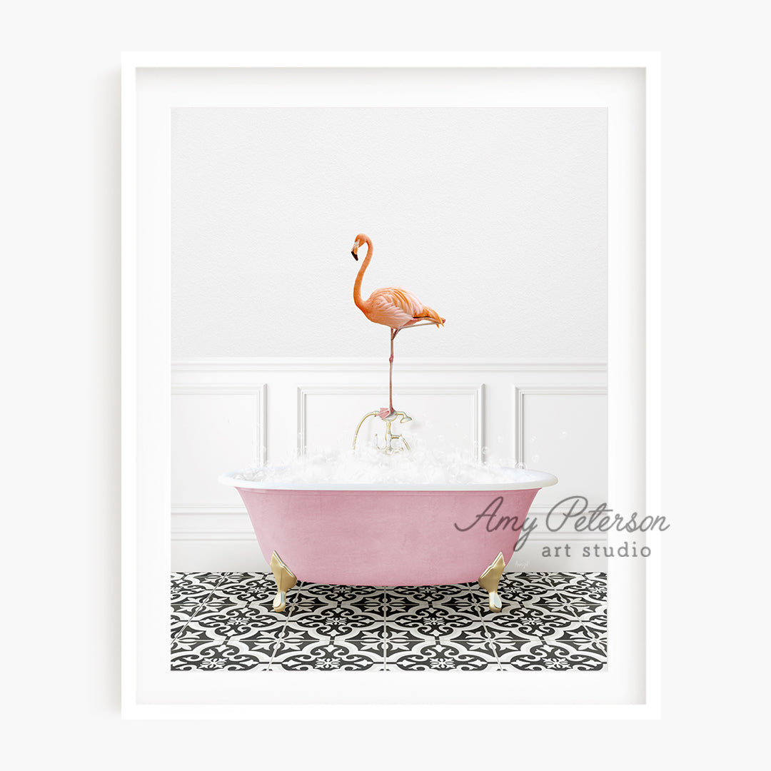 a pink bathtub with a pink flamingo standing on top of it