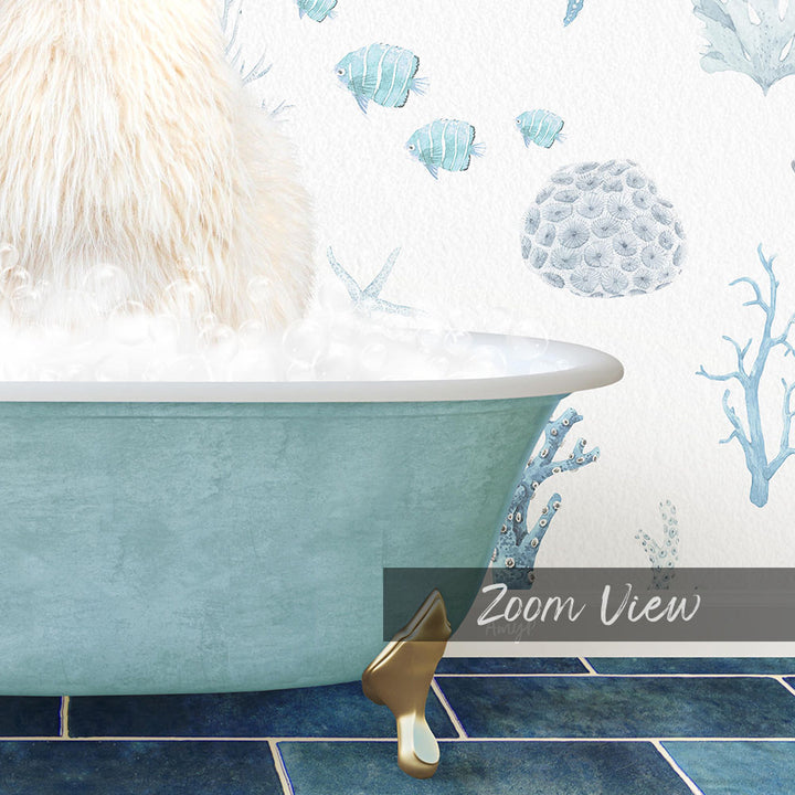 A fluffy white cat sitting in a blue bathtub filled with bubbles, surrounded by a wallpaper with fish and coral designs.