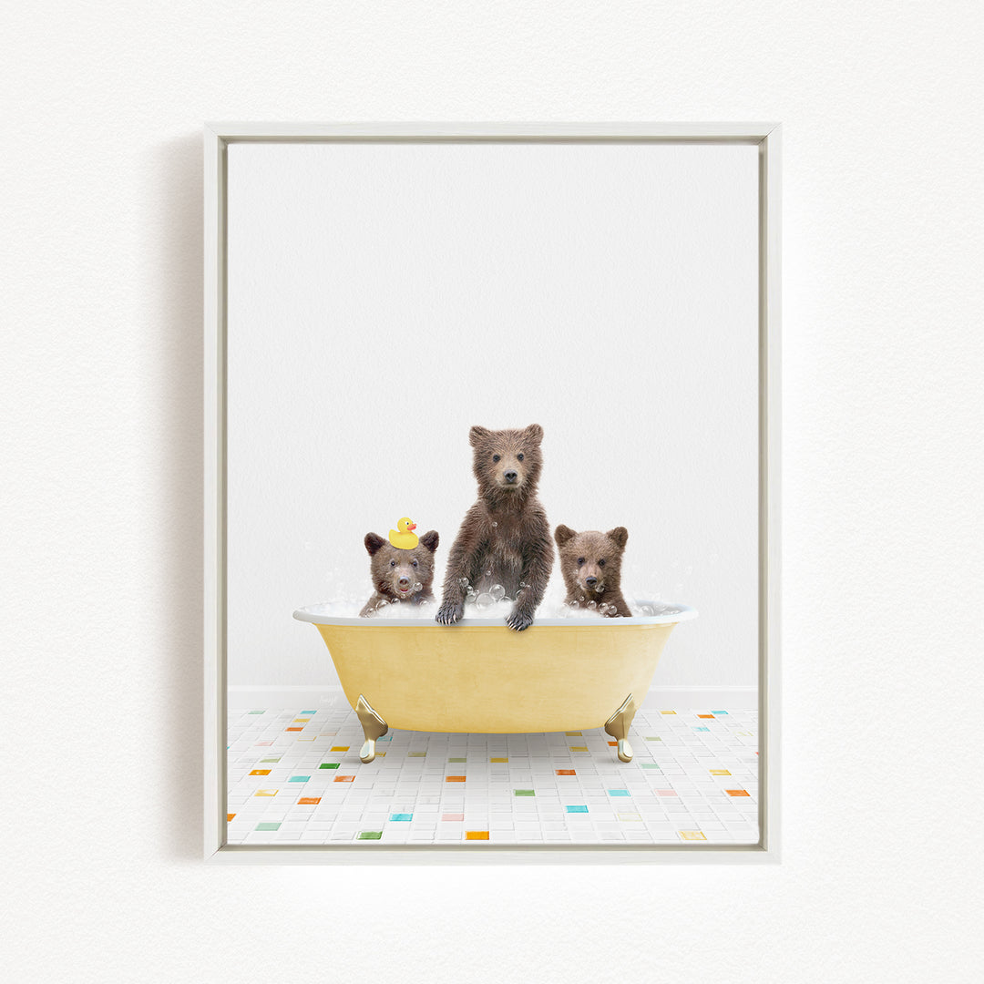 A framed image of three bears sitting in a yellow bathtub, with one bear sitting in the center and the other two bears sitting on either side.