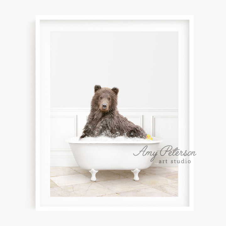 a brown bear sitting in a bath tub