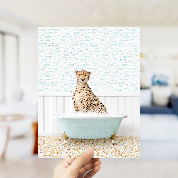 A cheetah sitting in a bathtub filled with bubbles, surrounded by a pattern of fish.