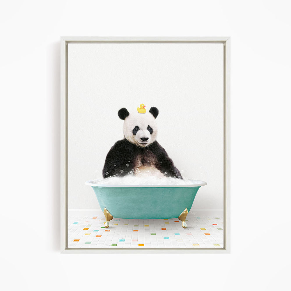 A panda bear sitting in a bathtub filled with bubbles, with a rubber duck floating on its head.