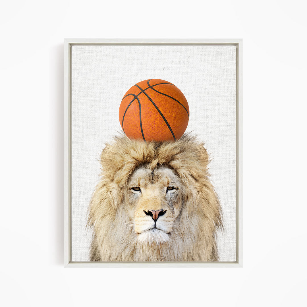 A lion with a basketball on its head.