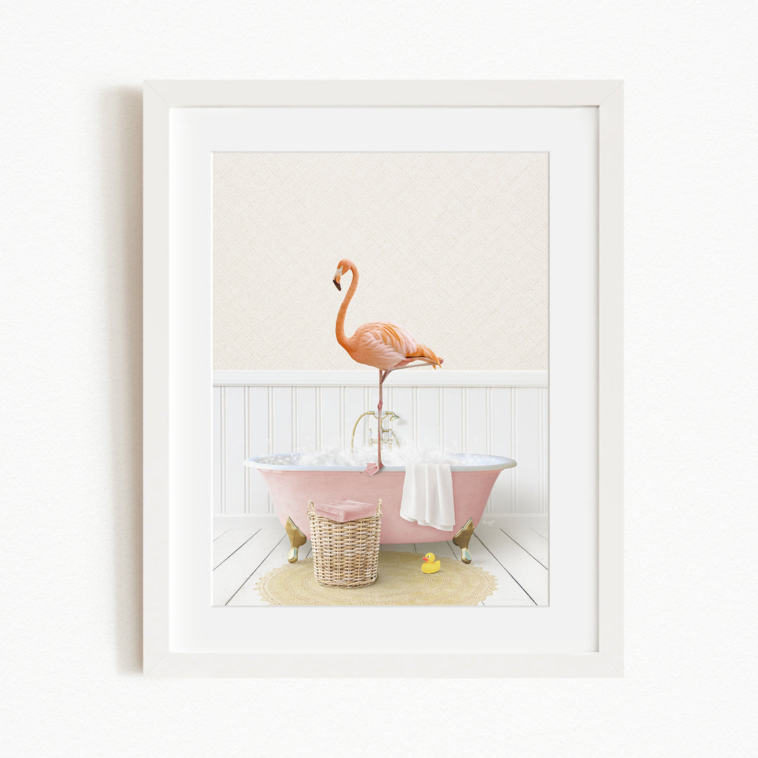 A pink clawfoot bathtub filled with water, with a flamingo standing on the edge of the tub.