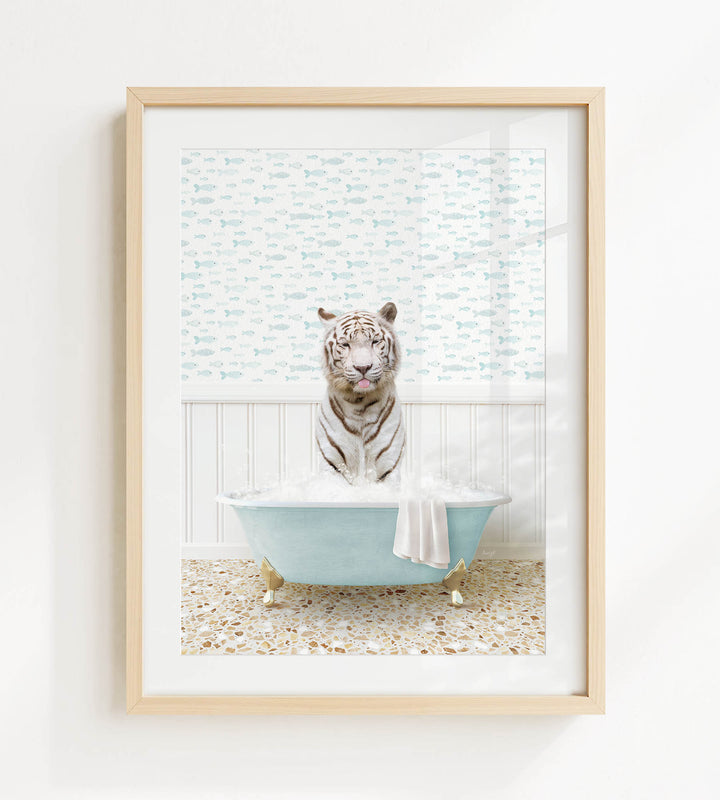 A white tiger sitting in a blue bathtub filled with bubbles, surrounded by a patterned wall and a tiled floor.