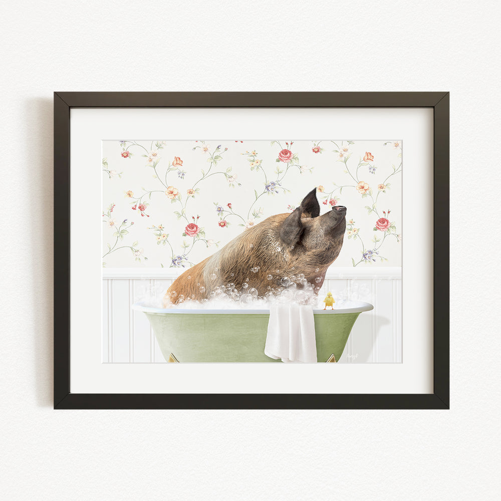 A brown pig sitting in a green bathtub filled with bubbles, surrounded by a floral patterned wall.
