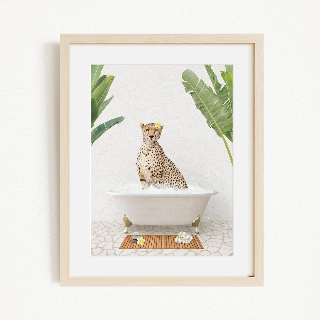 A cheetah sitting in a bathtub filled with water, surrounded by tropical plants.