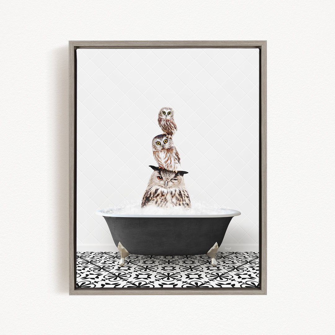 A framed image depicting three owls sitting in a bathtub filled with water, creating a whimsical and playful scene.