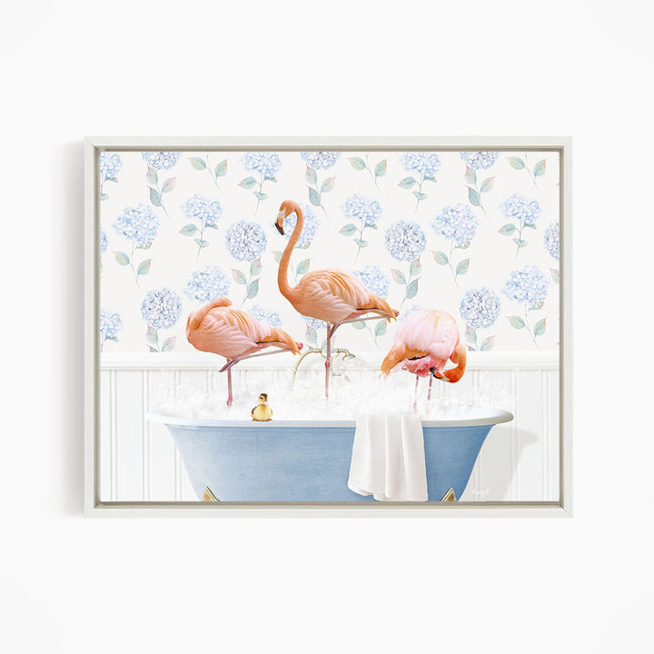 A framed image depicting three flamingos standing in a blue bathtub filled with water, surrounded by a floral patterned wall.
